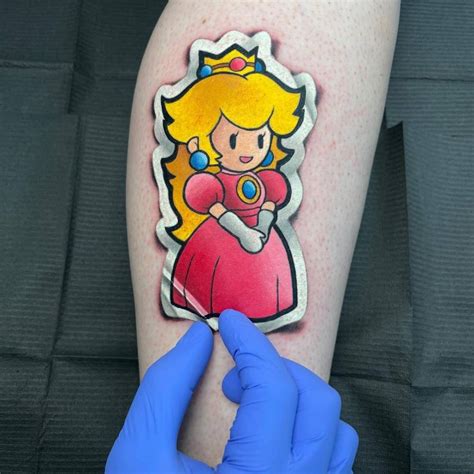 TikTok video from Leilah (leilahtheartist) Color princess peach tattoo done by me Book your next tattoo with . . Princess peach tattoo
